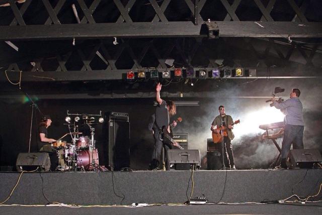 Under a Banner on the set of the music video for Numbers.